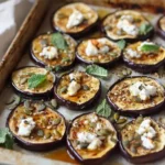 Berenjena Asada con Miel, Queso de Cabra y Semillas de Calabaza